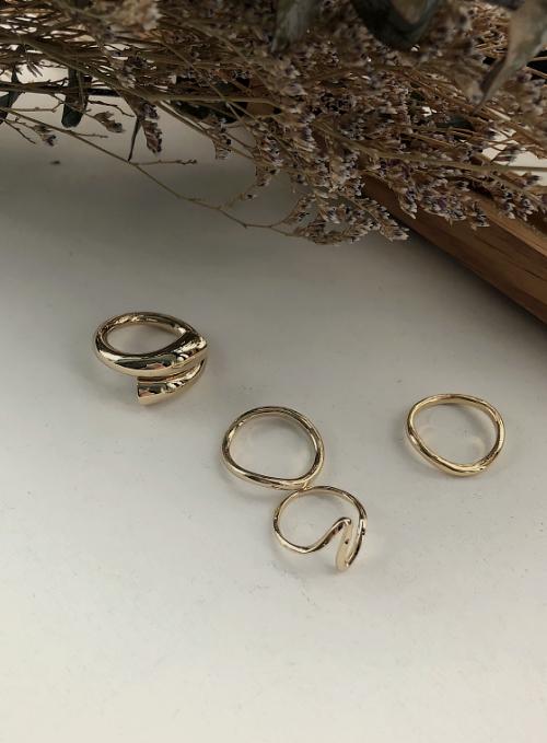 Four Curved Gold Ring Set